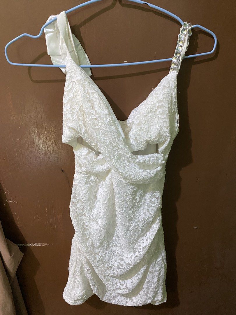 White Lace Top with Embellished Strap (Category: Sleeveless) located in Ozamiz City. Submitted by sw4gcvnt (Listing ID 1423238602, Image 1). Description: - White lace one-shoulder top - Embellished strap - Ruched waist detail - Delicate lace fabric - V-neck back - Ideal for special events.