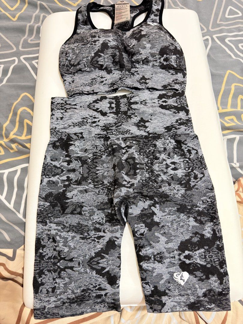 Women's Best Activewear Set (Category: Activewear) located in Manila. Submitted by decluttermomma.ph (Listing ID 1423151397, Image 1). Description: - Women's Best activewear set - Includes a sports bra and biker shorts - Gray and black camouflage pattern - Sports bra: Racerback design - Shorts: High-waisted - Made of seamless, stretchy material - Features the Women's Best logo.