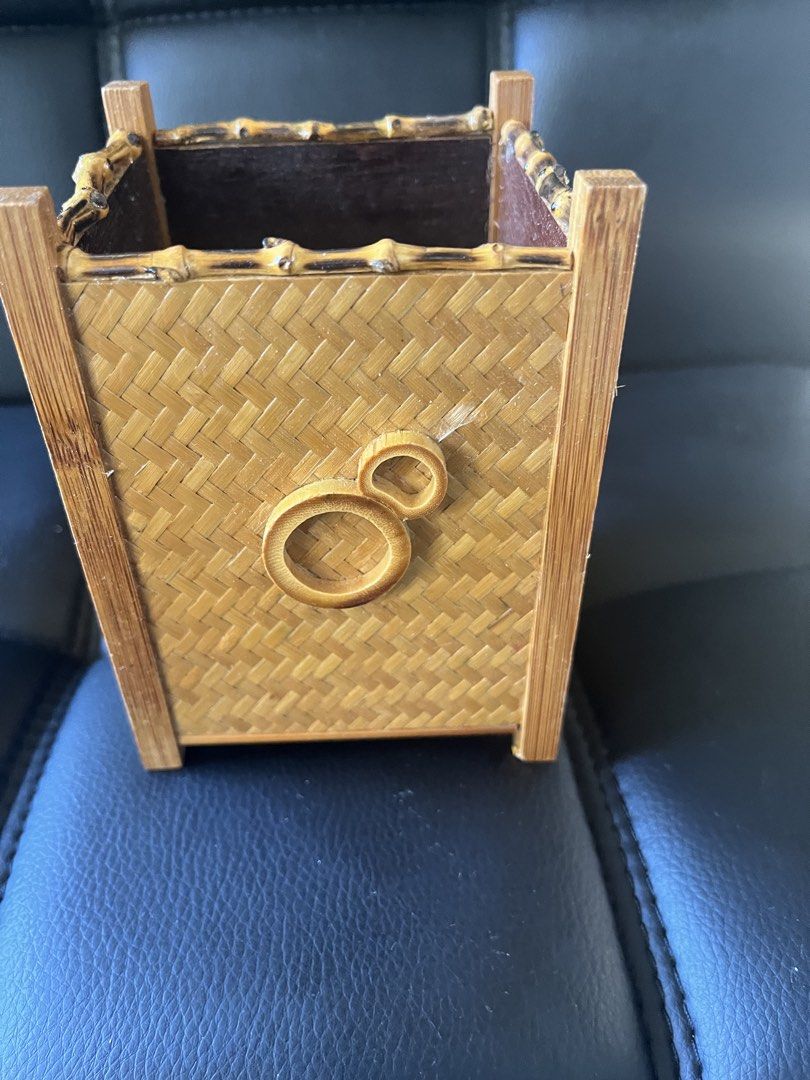 Woven Bamboo Basket/storage (Category: Storage Boxes & Baskets) located in Calasiao. Submitted by maxwayne200413 (Listing ID 1423191897, Image 1). Description: - Woven bamboo basket - Square shape - Decorative handle - Sturdy construction - Suitable for small items or decor - Natural bamboo color with dark brown interior.