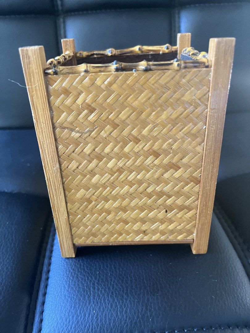 Woven Bamboo Basket/storage (Category: Storage Boxes & Baskets) located in Calasiao. Submitted by maxwayne200413 (Listing ID 1423191897, Image 3). Description: - Woven bamboo basket - Square shape - Decorative handle - Sturdy construction - Suitable for small items or decor - Natural bamboo color with dark brown interior.