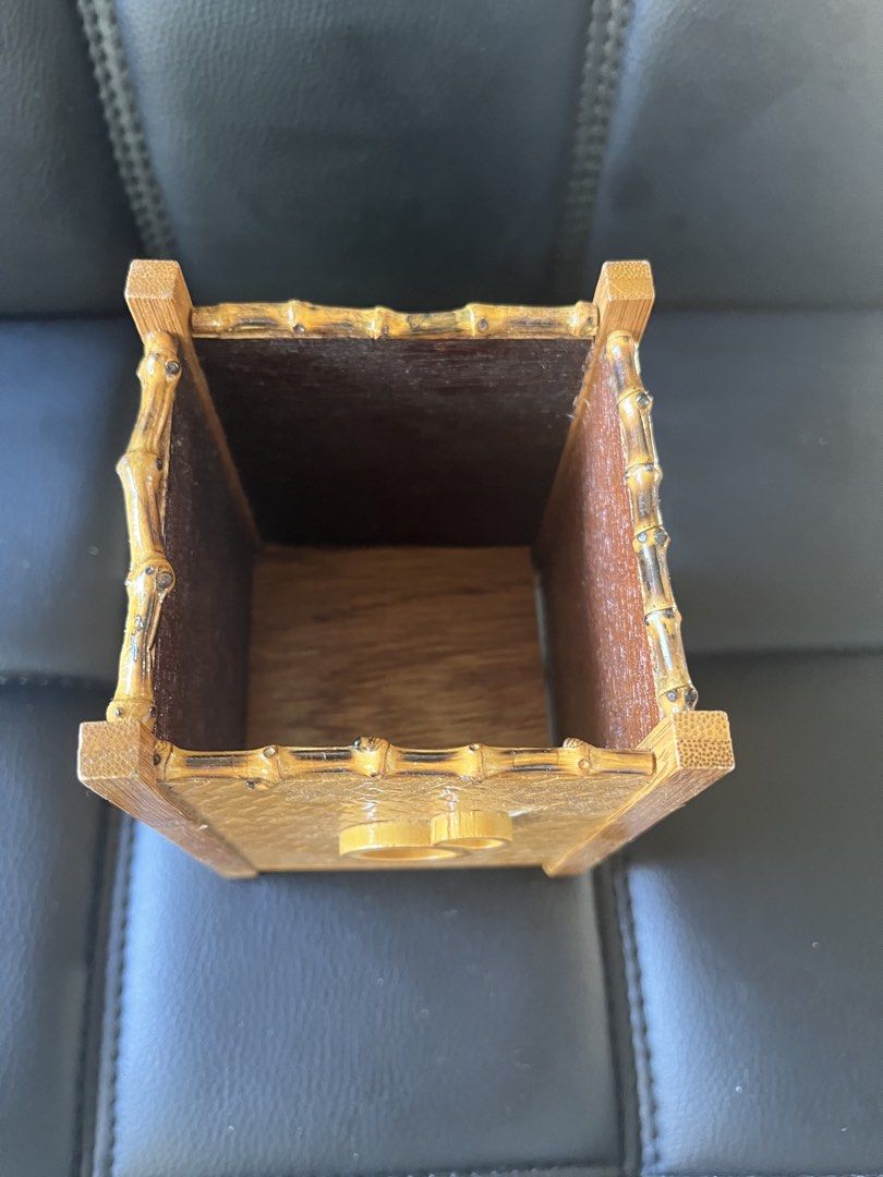 Woven Bamboo Basket/storage (Category: Storage Boxes & Baskets) located in Calasiao. Submitted by maxwayne200413 (Listing ID 1423191897, Image 2). Description: - Woven bamboo basket - Square shape - Decorative handle - Sturdy construction - Suitable for small items or decor - Natural bamboo color with dark brown interior.