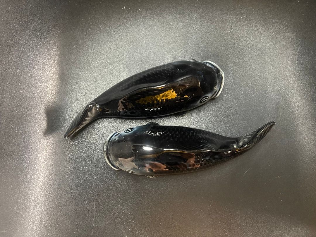 1950s Ceramic Fish Wall Pocket Vase | Vintage (Category: Other Home Decor) located in Quezon City. Submitted by reallyrealreal (Listing ID 1423318959, Image 1). Description: Original Price: 8000 Bought in the 1950s Dimensions in the photos SKQCET0049 - Vintage fish-shaped salt and pepper shakers - Glossy black finish with iridescent highlights - Detailed design featuring fins and open mouths - Each shaker has a hole on the bottom.