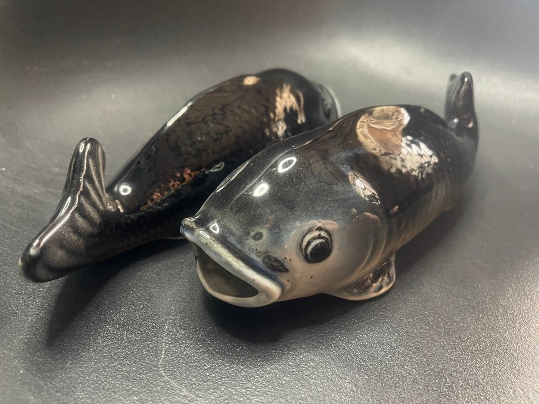 1950s Ceramic Fish Wall Pocket Vase | Vintage (Category: Other Home Decor) located in Quezon City. Submitted by reallyrealreal (Listing ID 1423318959, Image 3). Description: Original Price: 8000 Bought in the 1950s Dimensions in the photos SKQCET0049 - Vintage fish-shaped salt and pepper shakers - Glossy black finish with iridescent highlights - Detailed design featuring fins and open mouths - Each shaker has a hole on the bottom.
