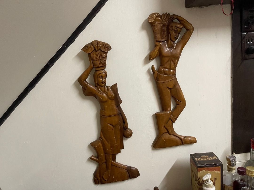 1960s Wooden Decor | Vintage (Category: Wall Decor) located in Quezon City. Submitted by reallyrealreal (Listing ID 1423322534, Image 1). Description: Original Price: 5000 Bought in the 1960s From the Philippines Unknown wood type Per piece Width: 16 Depth: Height: 57 SKQCET0047 - Set of two wooden carved figures - Depicts a man and a woman - Figures are carrying baskets - Hand-carved details - Intended for wall decoration - Brown color - Glossy 