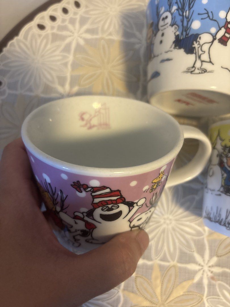 3 pcs: Snoopy x KFC Peanuts Christmas Mugs Set (Category: Coffee & Tea Tableware) located in Calamba. Submitted by cur8d (Listing ID 1423315468, Image 2). Description: - Set of three Peanuts Christmas mugs. - Each mug features a different Peanuts character (Snoopy, Charlie Brown, etc.) in a winter/Christmas scene. - Designs include snowmen, snow, and Christmas trees. - White interior and handle. - Made of ceramic..