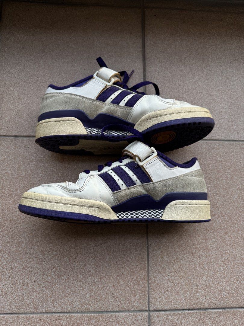Adidas Forum 84 Low Off White/Core Purple (Category: Sneakers) located in Makati City. Submitted by flypar (Listing ID 1423388209, Image 2). Description: - Colorway: Off White/Core Purple - Size: EU 42 / UK 8 / US 9 - Features the iconic Forum design with strap and stripes - Condition: Good, with a vintage look - Meetup Locations: Glorietta and Greenbelt 5 (Makati).