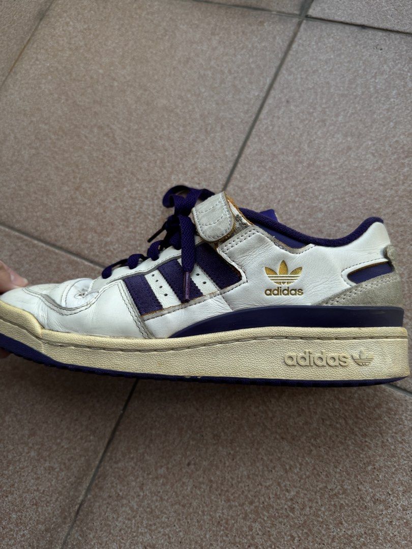Adidas Forum 84 Low Off White/Core Purple (Category: Sneakers) located in Makati City. Submitted by flypar (Listing ID 1423388209, Image 1). Description: - Colorway: Off White/Core Purple - Size: EU 42 / UK 8 / US 9 - Features the iconic Forum design with strap and stripes - Condition: Good, with a vintage look - Meetup Locations: Glorietta and Greenbelt 5 (Makati).