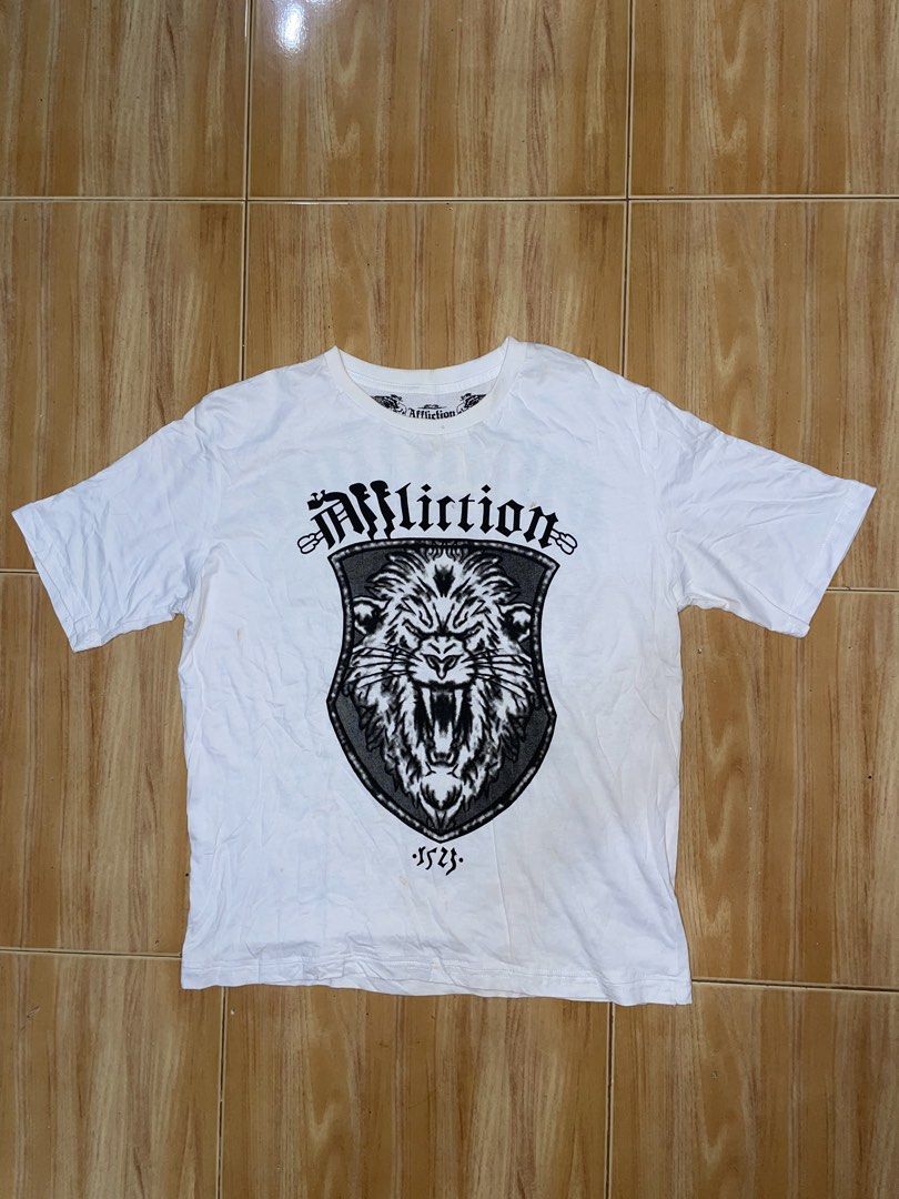 Affliction Lion Graphic T-shirt (Category: Tshirts & Polo Shirts ) located in Manila. Submitted by earlonashow (Listing ID 1423335374, Image 2). Description: issue: need wash 22x26.