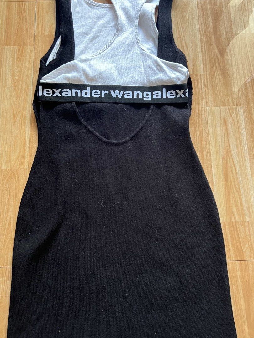 Alexander Wang Sleeveless Dress (Category: Dresses) located in Caloocan City. Submitted by wildfox-48eb (Listing ID 1423344068, Image 2). Description: - Alexander Wang sleeveless dress - Features a black body with a white racerback top - Brand name detail on waistband - Size: L - Material: 100% polyester, 100% cotton.