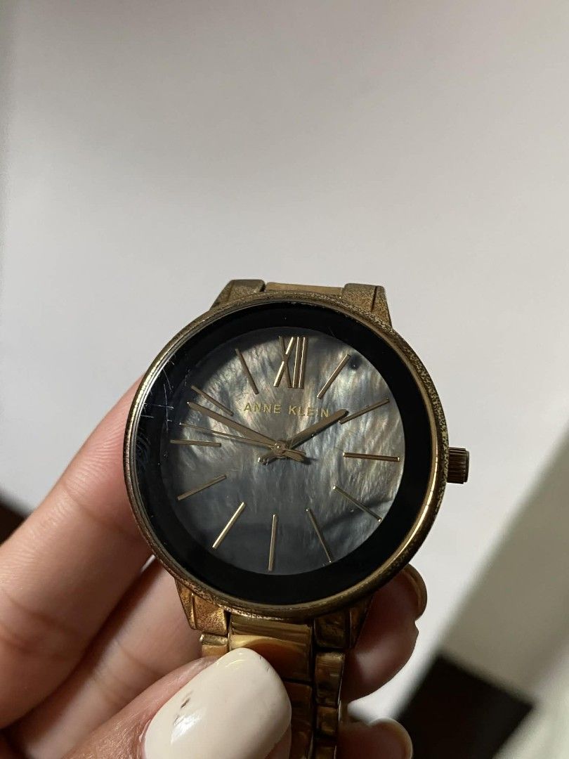Anne Klein Gold Watch 37mm (Category: Women's Watches) located in Makati City. Submitted by legittttt (Listing ID 1423346617, Image 2). Description: - Anne Klein watch - Gold-tone bracelet and case -Black dial with gold-tone hands and markers - Stainless steel back - Water resistant to 100ft - Comes with original box Original working with battery.
