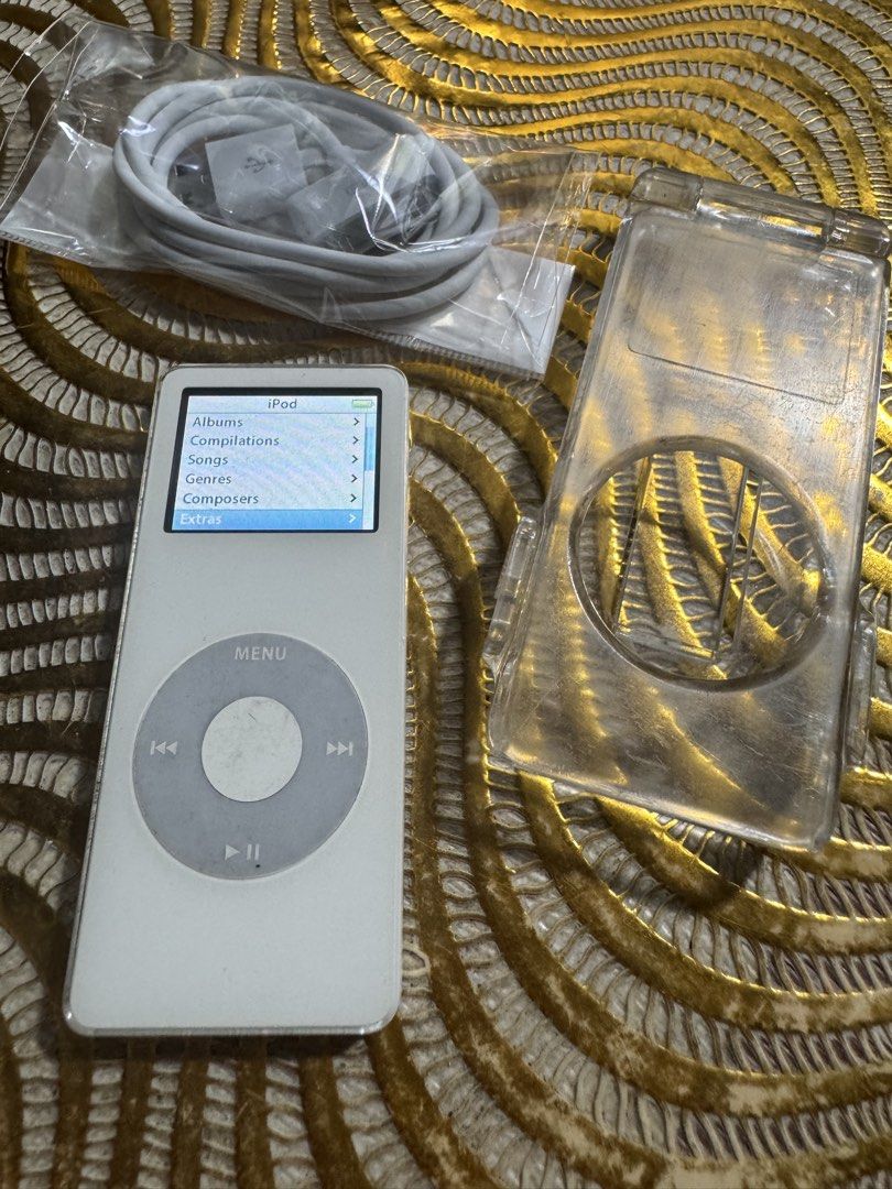 Apple iPod nano 1st generation 2GB (Category: Portable Music Players) located in Quezon City. Submitted by angace13 (Listing ID 1423372284, Image 2). Description: selling my ipod nano 1st gen 2gb no issue ready to use battery still good with case with charger with songs already walang sakit sa ulo fast sync pm nlng sa interested ty.