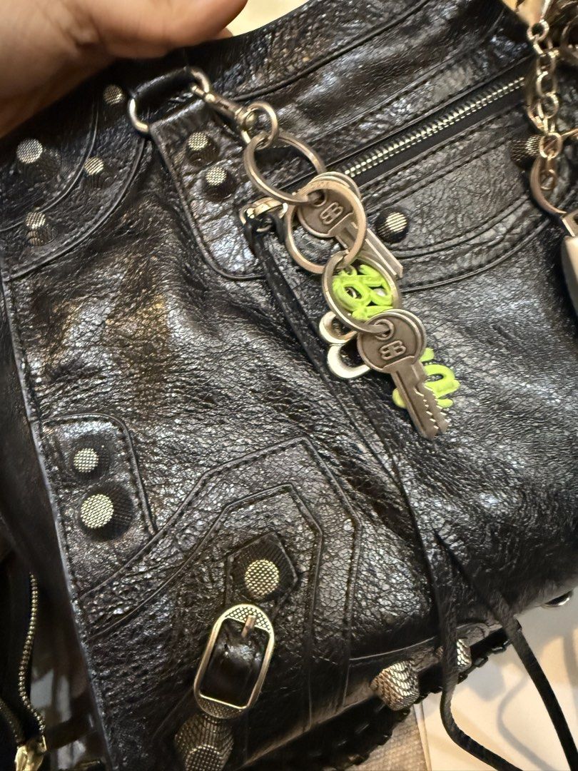 Balenciaga Classic City Handbag (Category: Luxury Bags & Wallets) located in Manila. Submitted by thebodega88 (Listing ID 1423318005, Image 2). Description: -Balenciaga Cagol City handbag CODED NAPPA LEATHER NO FLAWS - Color: Black - Silver-tone hardware (studs, buckles) - Top handle - Zip closure - Interior leather tag with brand name - Front zip pocket - Includes keys and key ring - Made in Italy.