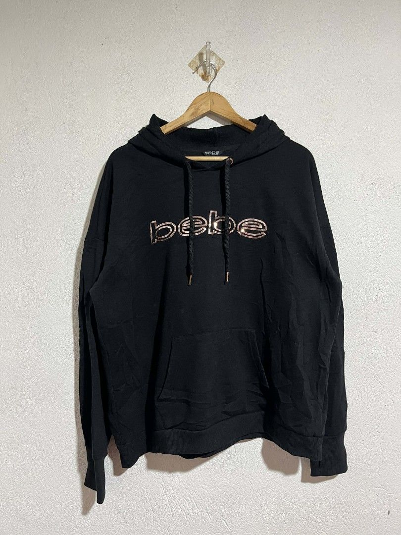 Bebe Sport Hoodie 2X (Category: Coats, Jackets and Outerwear) located in Cebu City. Submitted by lesthrift (Listing ID 1423321975, Image 1). Description: - Bebe Sport hoodie - Size: 2X - Features a sequined brand logo - Drawstring hood - Front pocket - Material: Cotton/Polyester blend - Long sleeves - Comfortable fit.