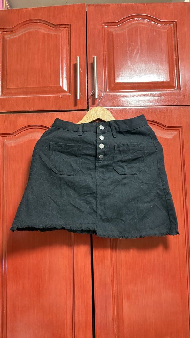 Black Denim Skirt with Button Detail (Category: Skirts) located in Amadeo. Submitted by beaflr (Listing ID 1423406806, Image 1). Description: Size 26-27.