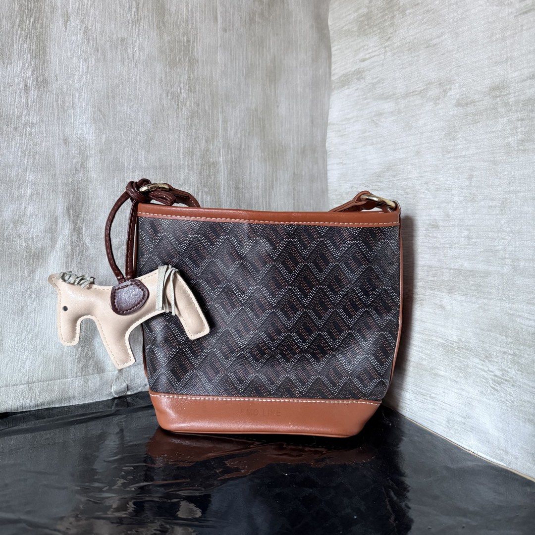 Brown Shoulder Bag with Horse Charm (Category: Shoulder Bags) located in Dagupan City. Submitted by hangoverph (Listing ID 1423314354, Image 1). Description: - Once used - Perfect for everyday wear or special events - Brand: Emo Like (Korean Brand) - RFS: decluttering.