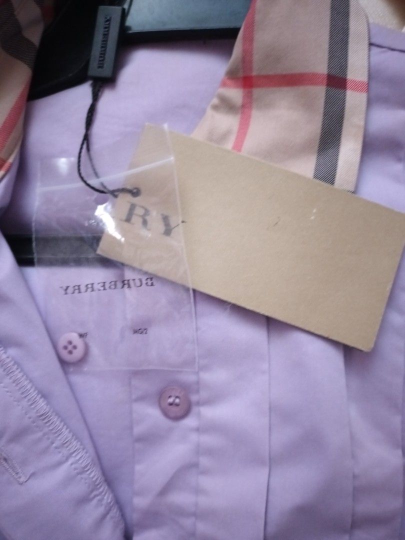 Burberry Brit Shirt (purple) (Category: Tshirts & Polo Shirts ) located in Quezon City. Submitted by cncarousel (Listing ID 1423339850, Image 3). Description: - Authentic Burberry Brit shirt - Size: M - Color: Light Purple - Features classic check pattern on collar and cuffs - Button-down design - Includes original tags.
