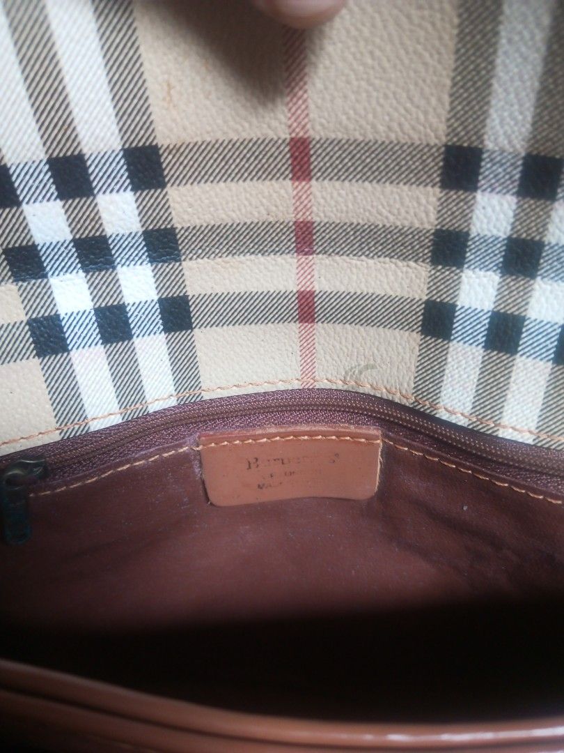 Burberry Crossbody Bag (Category: Luxury Bags & Wallets) located in Davao. Submitted by lordpabito71094 (Listing ID 1423372802, Image 2). Description: - Authentic Burberry crossbody bag - Iconic check pattern - Brown leather strap and trim - Magnetic flap closure - Brown interior lining - Brand logo on zipper - Classic and timeless design.