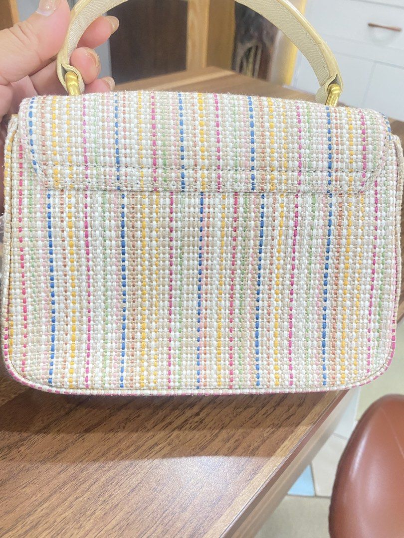 Carlyn Handbag (Category: Luxury Bags & Wallets) located in Guiuan. Submitted by obladi_oblada (Listing ID 1423268201, Image 2). Description: - Brand: CARLYN - Style: Handbag - Exterior: Woven with gold-tone lock closure - Shape: Rectangular - Handle: Top handle - Pattern: Multi-colored stripes - Interior: Lined with light-colored fabric -handbag only no sling strap.