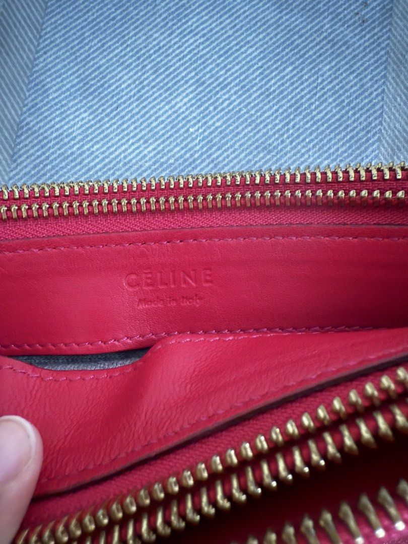 Celine Trio Crossbody Bag (Category: Luxury Bags & Wallets) located in Del Monte. Submitted by mftngc (Listing ID 1423288130, Image 3). Description: - Authentic Celine trio bag - Medium Size - Red leather exterior - Gold zipper - Long, thin strap - Red interior with Celine logo and "Made in Italy" stamp - Celine logo on front .