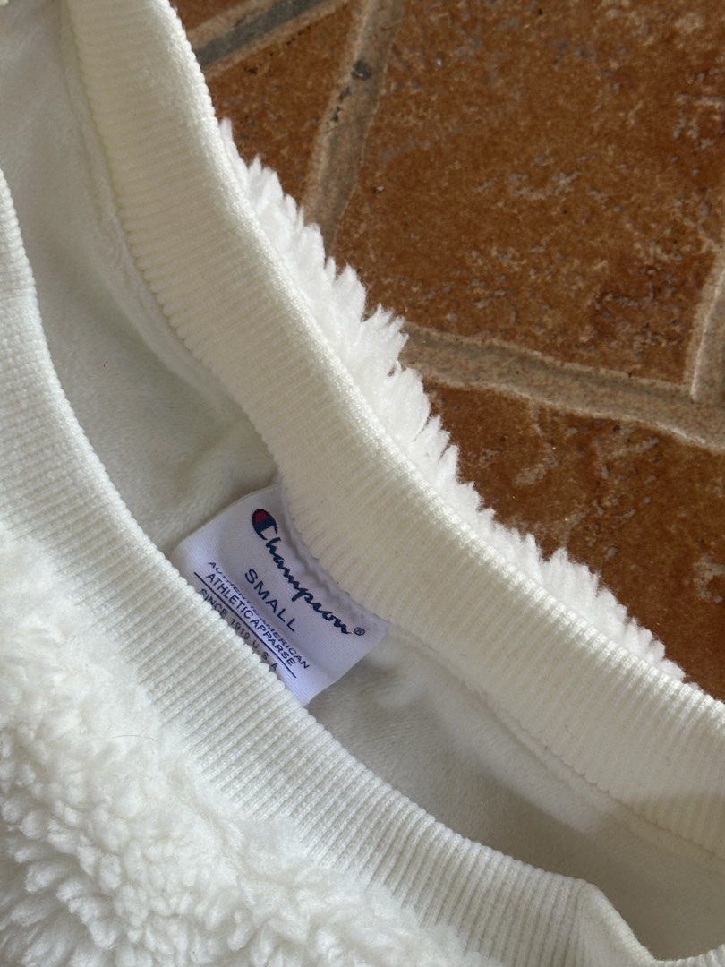 Champion Sherpa Sweatshirt - Small (Category: Coats, Jackets and Outerwear) located in Bago City. Submitted by thekasproject (Listing ID 1423317218, Image 3). Description: Champion sherpa sweatshirt in white, size Small. Features embroidered logos on chest and sleeve. Crew neck with ribbed cuffs and hem. Good as new 1580 freeshipping nationwide .
