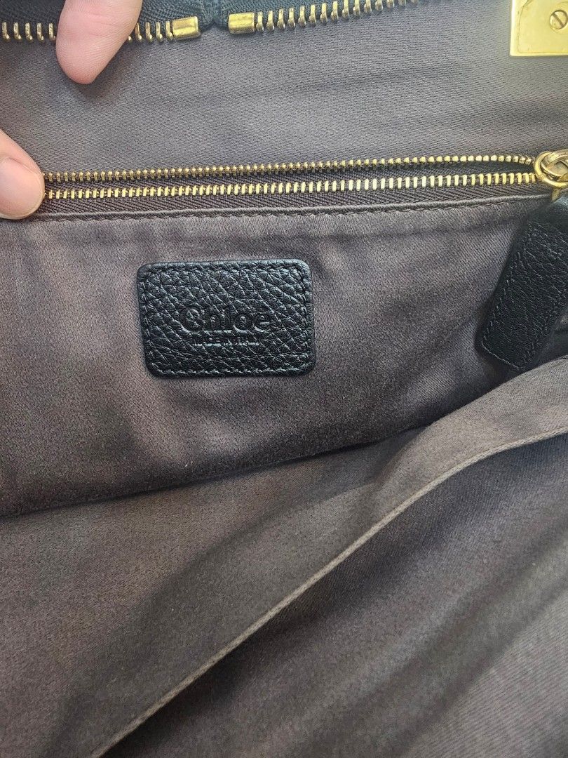 Chloe Black Leather Handbag with Gold Hardware (Category: Luxury Bags & Wallets) located in Las Pinas. Submitted by vanpru (Listing ID 1423325094, Image 3). Description: Chloe top handle bag Very good condition With provided strap - Black leather handbag - Gold-toned hardware - Top handle and detachable shoulder strap - Interior zippered pocket - Brand label - Includes dust bag - Textured leather exterior - Zippered closure.