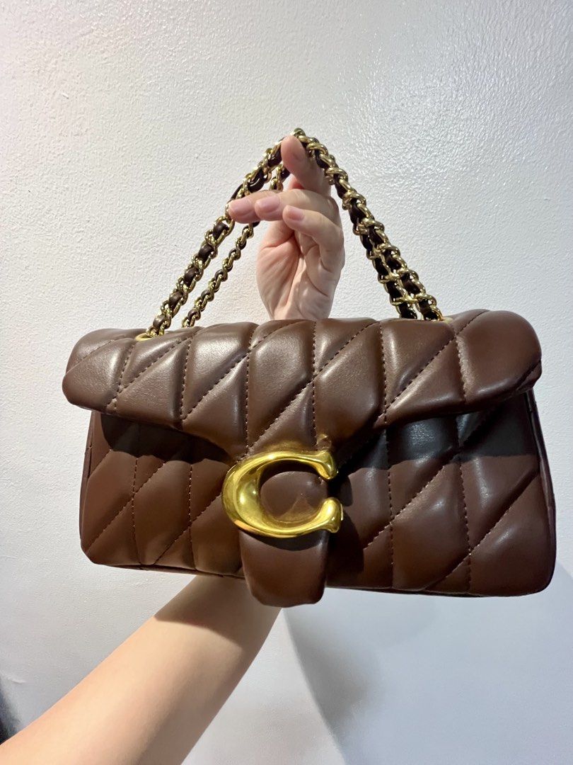 Coach Pillow Quilted Tabby Shoulder Bag 26 (Category: Luxury Bags & Wallets) located in Manila. Submitted by seagypseaph (Listing ID 1423345633, Image 2). Description: 20% OFF! Happening from May 18-25! OG Price: Php6,800 Coach Pillow Tabby Shoulder Bag 26 Rank S-A (Brand new-like new condition; Not guaranteed auth) - Pillow Quilted design - Rich maple brown color (rare color) - Gold Chain strap (adjustable/worn 2 ways) - Flap closure with gold-t
