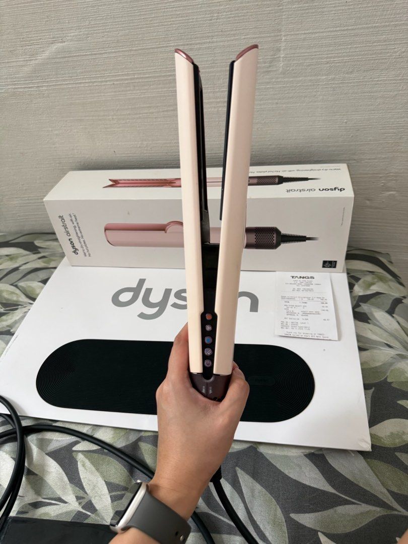 Dyson AirStrait Ceramic Pink (Category: Hair) located in Pasay City. Submitted by declutterwithkae (Listing ID 1423303806, Image 3). Description: - Condition is still at 9/10 - Perfectly working. Complete with paper bag, box and receipt. - Slightly nego - Bought it at TANGS Singapore on November 2024 for 749 sgd RFS: Switching to Airwrap Co-anda.