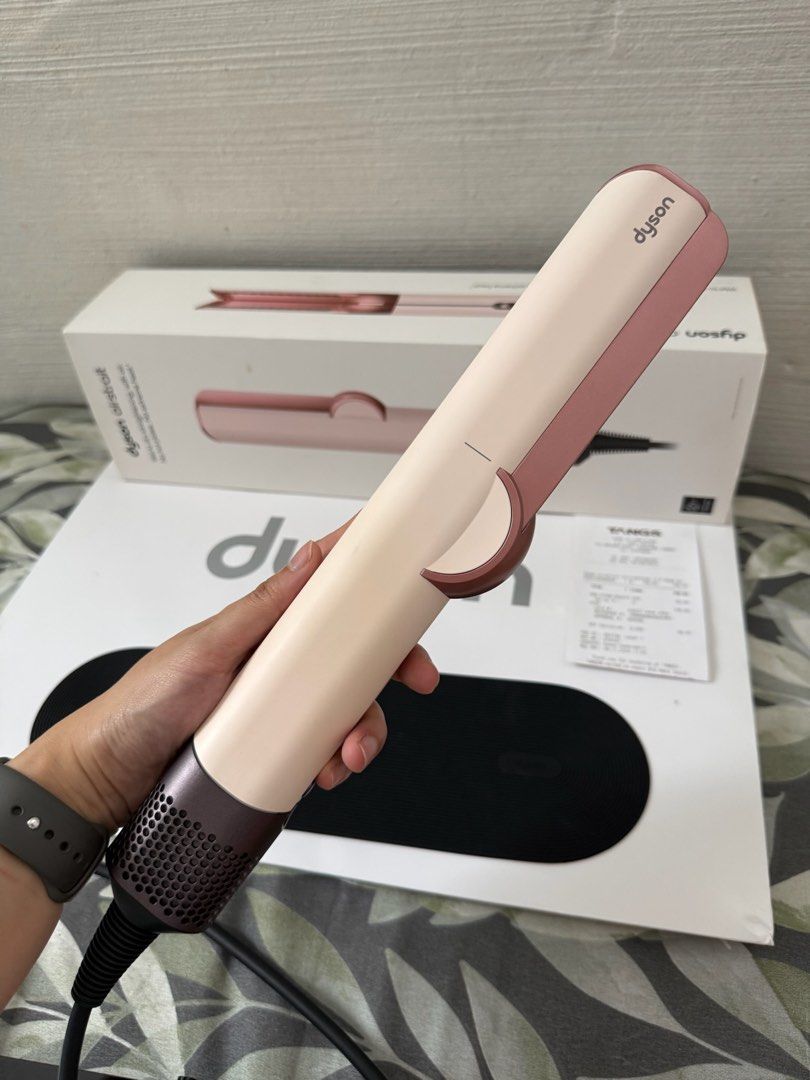 Dyson AirStrait Ceramic Pink (Category: Hair) located in Pasay City. Submitted by declutterwithkae (Listing ID 1423303806, Image 2). Description: - Condition is still at 9/10 - Perfectly working. Complete with paper bag, box and receipt. - Slightly nego - Bought it at TANGS Singapore on November 2024 for 749 sgd RFS: Switching to Airwrap Co-anda.