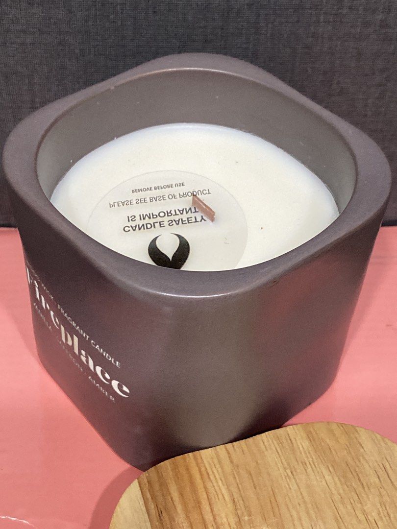 Fireplace Scented Candle with Wooden Lid (Category: Home Fragrance) located in Taguig. Submitted by cosmickindle (Listing ID 1423373813, Image 3). Description: •Scented candle with a wood wick •Fragrance: Vanilla, saffron, and amber •Comes in a gray ceramic container •Includes a wooden lid •Creates a cozy atmosphere •For home decor or bathroom scented candle •Slightly negotiable •RFS: Decluttering **First to pay gets it** **Please manage your exp