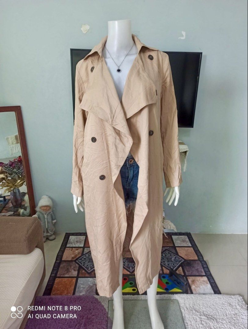 Forever 21 Trench Coat - Size S (Category: Coats, Jackets and Outerwear) located in San Juan City. Submitted by niqclassythrift (Listing ID 1423381138, Image 1). Description: - Forever 21 tan trench coat - Size: S - Double-breasted design - Features buttons - Classic trench coat style - Collar and long sleeves - Made in China.