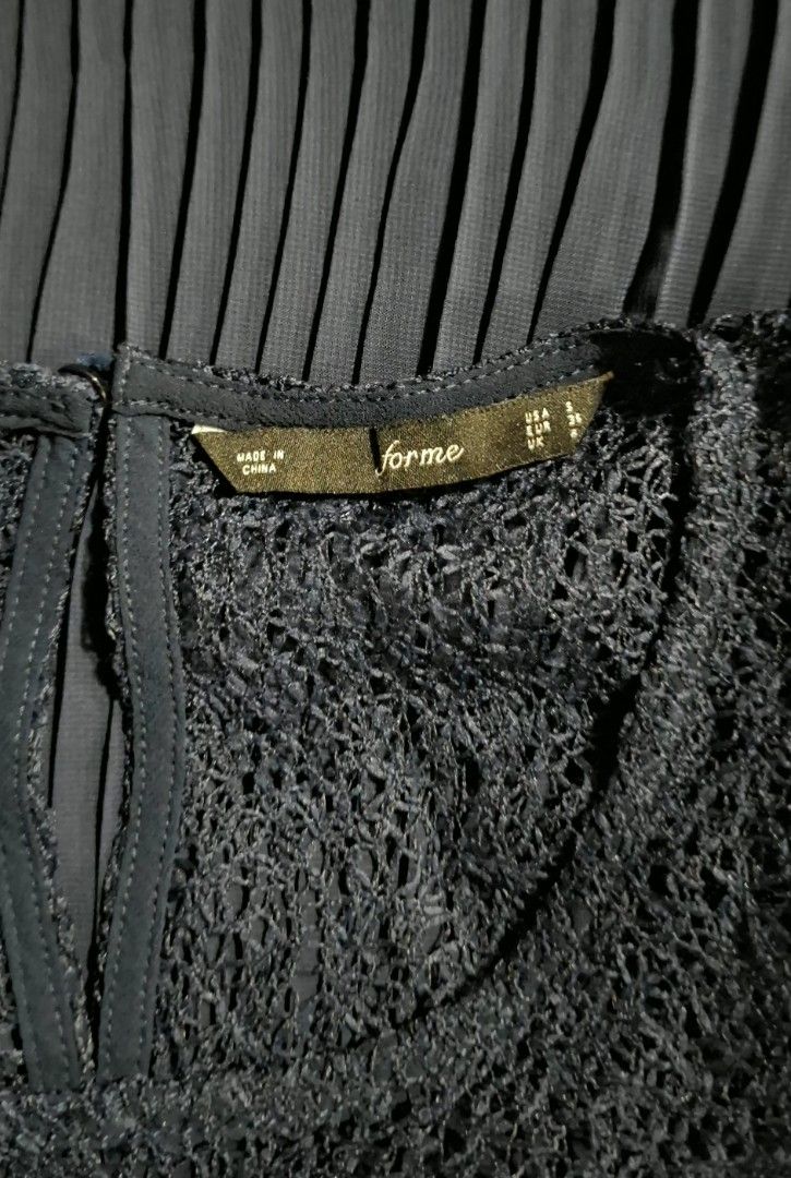 forme Navy Blue Pleated Top (Category: Blouses) located in Quezon City. Submitted by MP_Declutters (Listing ID 1423392644, Image 3). Description: - Forme navy blue top - Size: S - Color: Navy blue - Features: Pleated design, lace detailing on chest and shoulders - Style: Sleeveless - Back: Keyhole with button closure - Origin: Made in China 💰 Price: ₱600 (negotiable).
