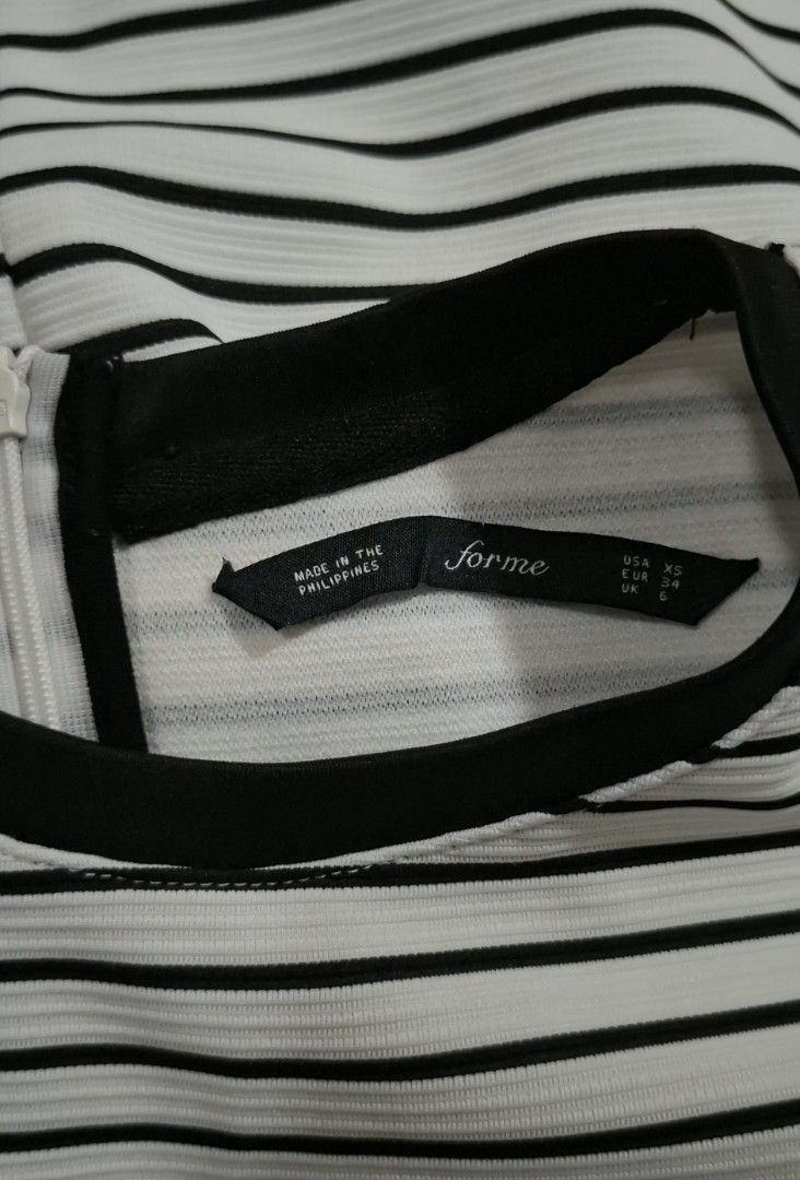 Forme Striped Dress (Category: Dresses) located in Quezon City. Submitted by MP_Declutters (Listing ID 1423381643, Image 3). Description: - Black and white striped dress - Short sleeves - Round neckline with black trim - Made in the Philippines - Size: XS - Features a back zipper Prices are negotiable — send your offer!.