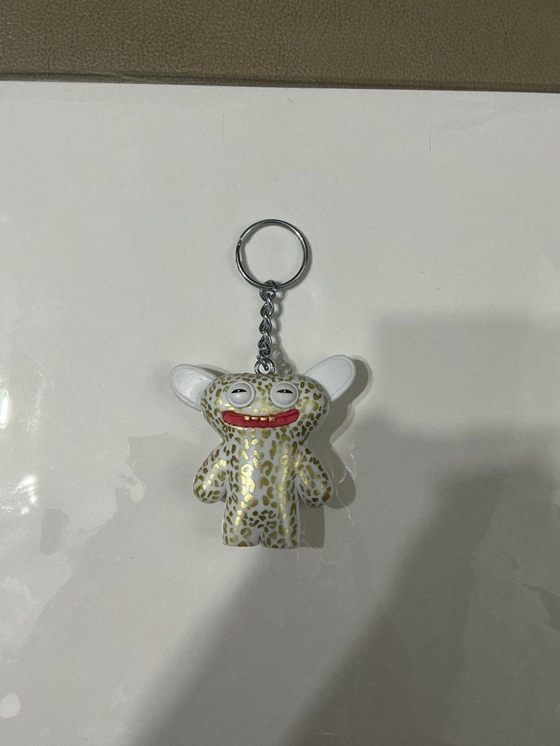 Fuggler Gold Edition Collectible Keychain (Category: Designer & Blind Box Toys) located in Legazpi City. Submitted by clutterbusterph (Listing ID 1423312423, Image 2). Description: - Collectible Fuggler Gold Edition Keychain - New with original packaging - Collectible item from the Fuggler Funny Ugly Monster series - 24 Carats of Chaos edition - rfs: not the one i wanted - BRAND NEW (literally kaka open ko lang sakanya kanina hahahaha).