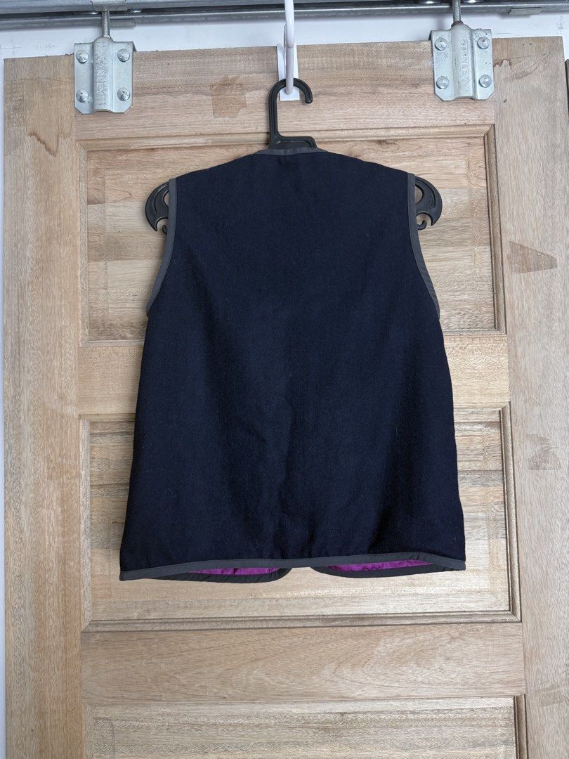 Go 2 Hollywood Patchwork Vest (Category: Vests) located in San Pablo. Submitted by zzz.archvs (Listing ID 1423428333, Image 2). Description: - Go 2 Hollywood vest - Size 130 - Navy exterior with patches - Floral patterned lining (purple base) - Button-up front - Gray trim - Two pockets - Fabric: Wool, acrylic, polyester.