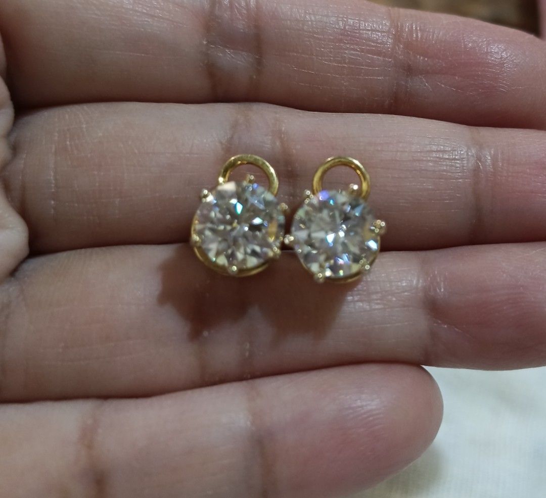Earrings with Moissanite Stones (Category: Earrings) located in Bulacan. Submitted by andiela (Listing ID 1423265081, Image 2). Description: - Yellow Gold stud earrings - Silver 925 setting in yellow gold vermeil - Clear, sparkling moissanite stones - 2.5 ct each stone total of 5ct - Classic design - Secure post backing - Suitable for everyday wear or special occasions - Adds a touch of sparkle.