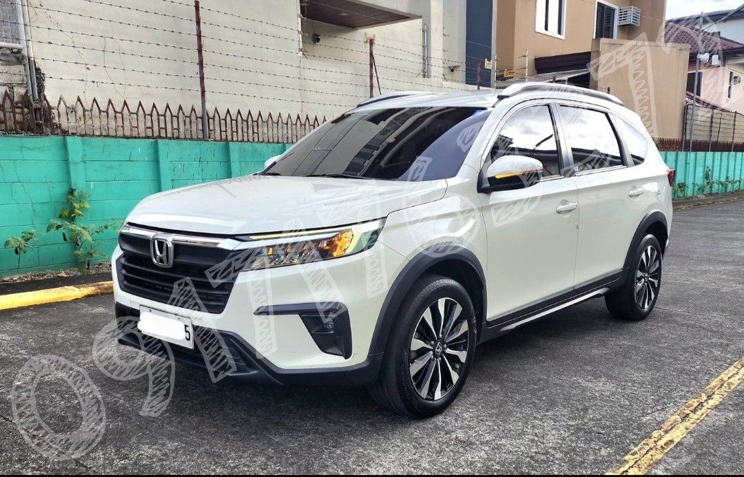 Honda BR-V (Category: Used Cars) located in San Mateo. Submitted by drahcirat63078 (Listing ID 1423310563, Image 3). Description: CAR FOR SALE HONDA BR-V 👉 CAR DETAILS: ● Honda BRV "S" Variant ● Automatic CVT ● 7 Seater ● Year model 2023 ● All stock ● Coding: Wednesday (plate ending 6) ● CASA maintained ● 61k odometer reading (lady driver) ● w/ existing dashcam back and front (QCY brand) ● medium tint (3M brand) ● w/ 2 remote keys (newly replace