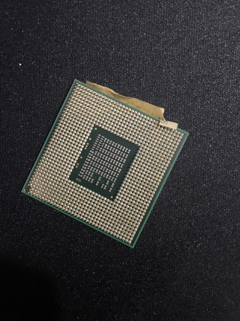 Intel CPU (Category: Computer Parts) located in Cyberjaya. Submitted by serumpun1 (Listing ID 1423260416, Image 2). Description: - Intel Desktop CPU - Square green substrate - Numerous pins on the bottom - Includes a sticker - Designed for desktop computers.