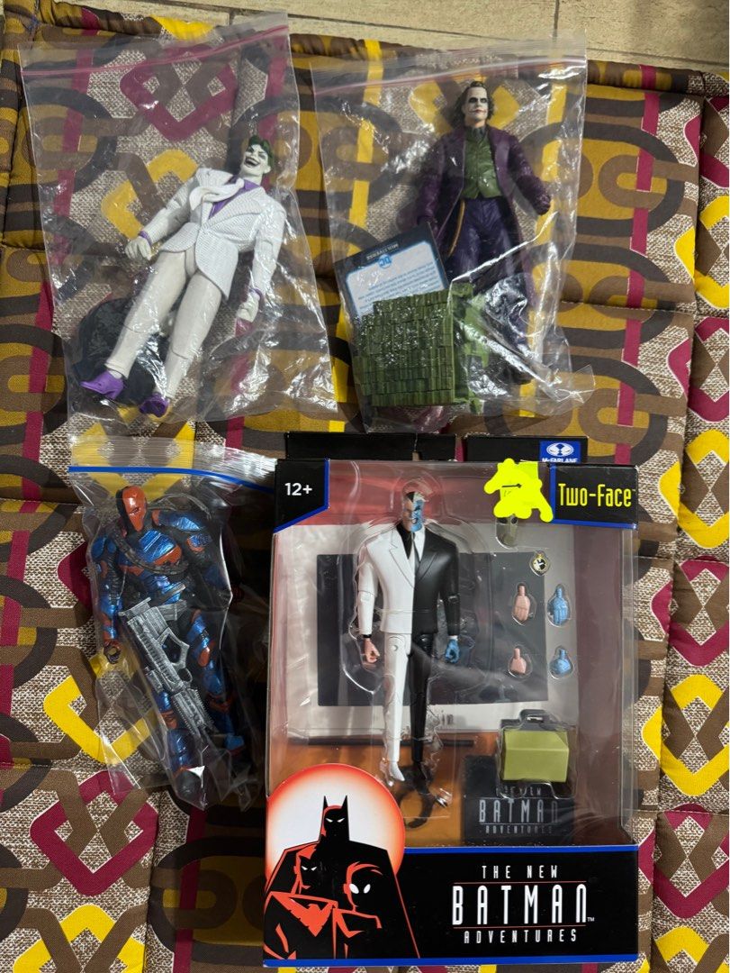 Joker Ledger mcfarlane , deathstroke, Two-Face, and More (Category: Figurines & Statues) located in Caloocan City. Submitted by marvel_vs_dc.movie (Listing ID 1423339143, Image 1). Description: - Batman action figure set. - Includes: - The Joker (white suit) 700 - The Joker (purple coat) 3500 - Two-Face (original packaging, from The New Batman Adventures) 1500 - Deathstroke customized woth guns 900.