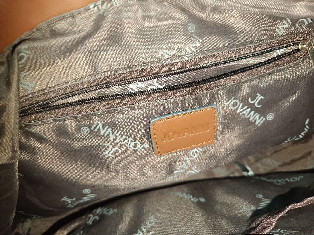 Jovanni Handbag with Brown Handles (Category: Luxury Bags & Wallets) located in Manila. Submitted by k_0ye (Listing ID 1423262695, Image 2). Description: - Jovanni handbag - Patterned exterior - Brown handles and accents - Top zipper closure - Spacious interior - Medium size - Suitable for everyday use.
