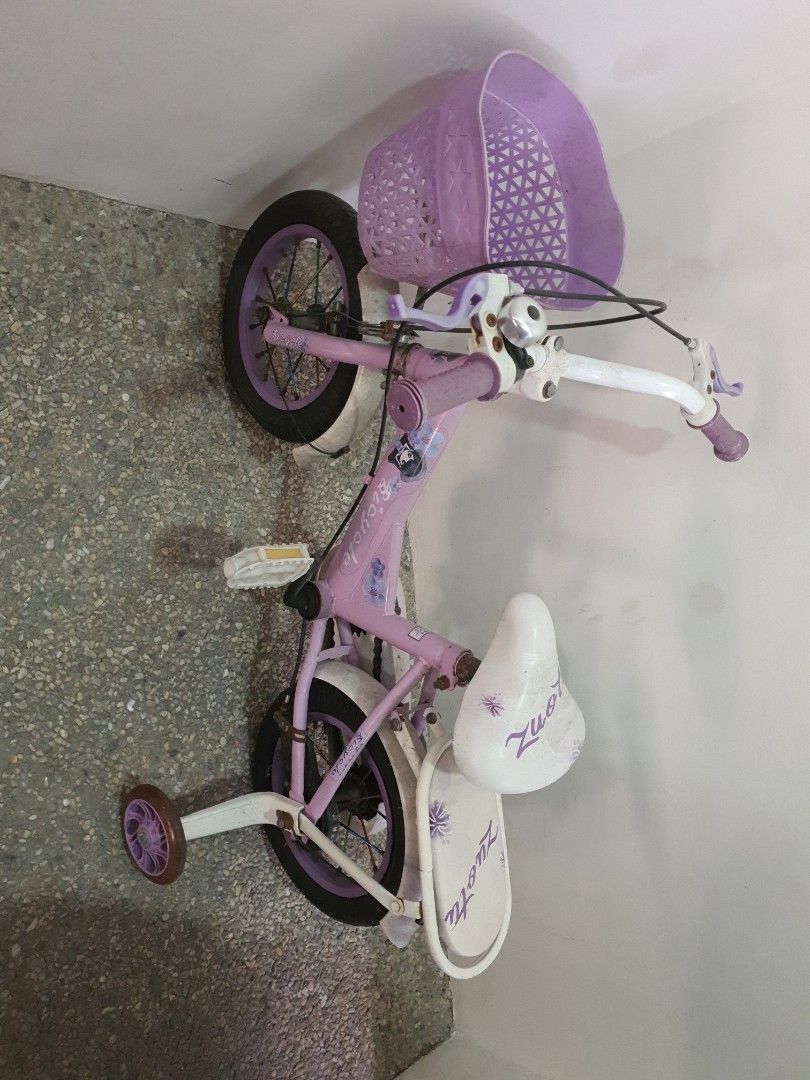Kids' Bicycle with Basket and Training Wheels (Category: Bicycles) located in Pasig City. Submitted by blissfultin (Listing ID 1423333557, Image 1). Description: - Purple frame and basket - Includes training wheels - Comfortable white seat with design - Purple handlebar accents - Features a bell - Includes a rear seat - Designed for young children 09778317238.
