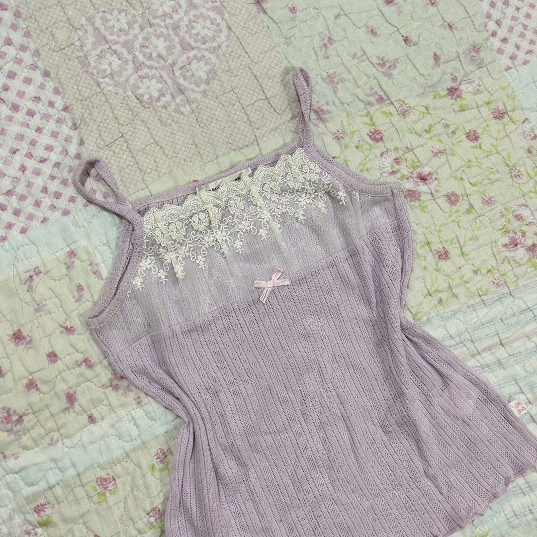 Lavender Pointelle Lace Trim Camisole/inner (Category: Sleeveless) located in Marikina City. Submitted by naiomeww (Listing ID 1423321602, Image 2). Description: 🌷 ideal for petite women - Size: XXS-XS - Pointelle fabric - Delicate lace trim - Adorable pink bow detail - Ribbed knit body - Thin straps - Lightweight fabric - Brand tag visible * dm for ww’s.