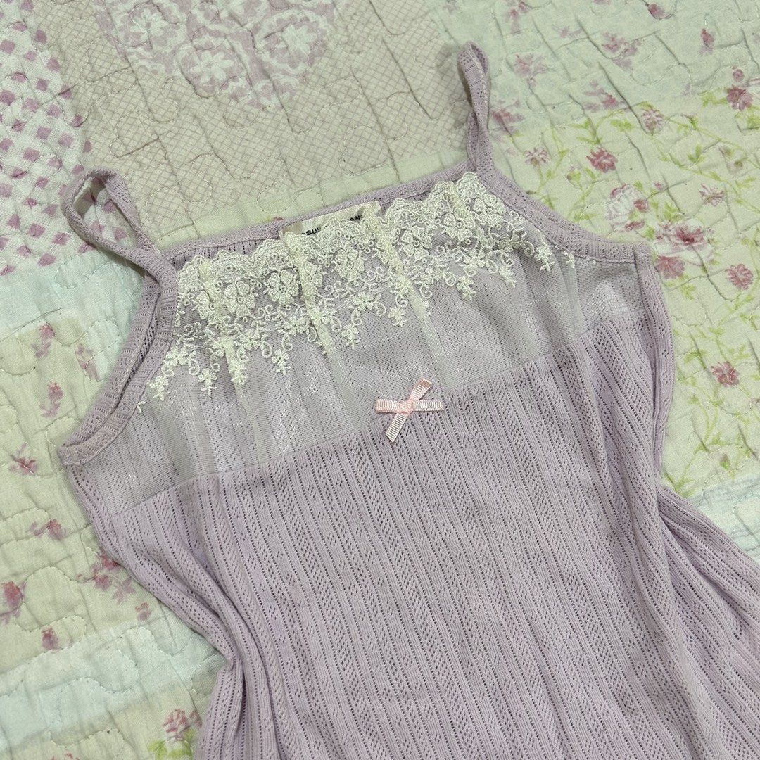 Lavender Pointelle Lace Trim Camisole/inner (Category: Sleeveless) located in Marikina City. Submitted by naiomeww (Listing ID 1423321602, Image 3). Description: 🌷 ideal for petite women - Size: XXS-XS - Pointelle fabric - Delicate lace trim - Adorable pink bow detail - Ribbed knit body - Thin straps - Lightweight fabric - Brand tag visible * dm for ww’s.