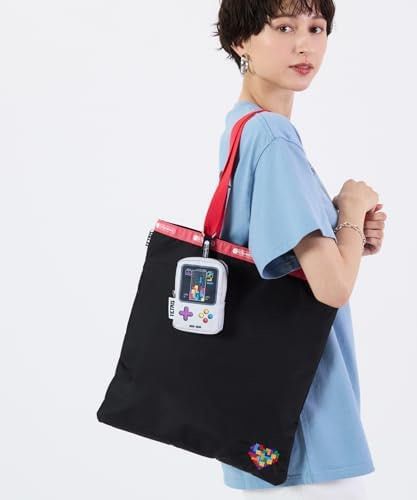 LeSportsac x Tetris Keyring Pouch (Category: Purses & Pouches) located in Dasmarinas. Submitted by markusi22 (Listing ID 1423302891, Image 3). Description: - LeSportsac x Tetris Keyring Pouch - Fun Tetris game design - Zipper closure - Keyring attachment - Interior lining with Tetris pattern - White pouch with black zipper - Tetris logo tag - Can be attached to a bag or used as a small pouch.