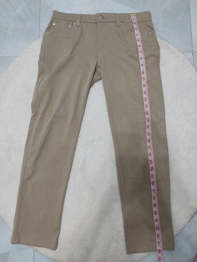 Levi's 501 Beige Pants (Category: Jeans) located in Malaybalay. Submitted by markdaumar08466 (Listing ID 1423335214, Image 3). Description: - Levi's 501 Beige Pants - Waist: Approximately 15 inches - Inseam: Approximately 29 inches - Classic five-pocket design - Features Levi's red tab - Button fly - Straight leg cut - Leather patch on back.