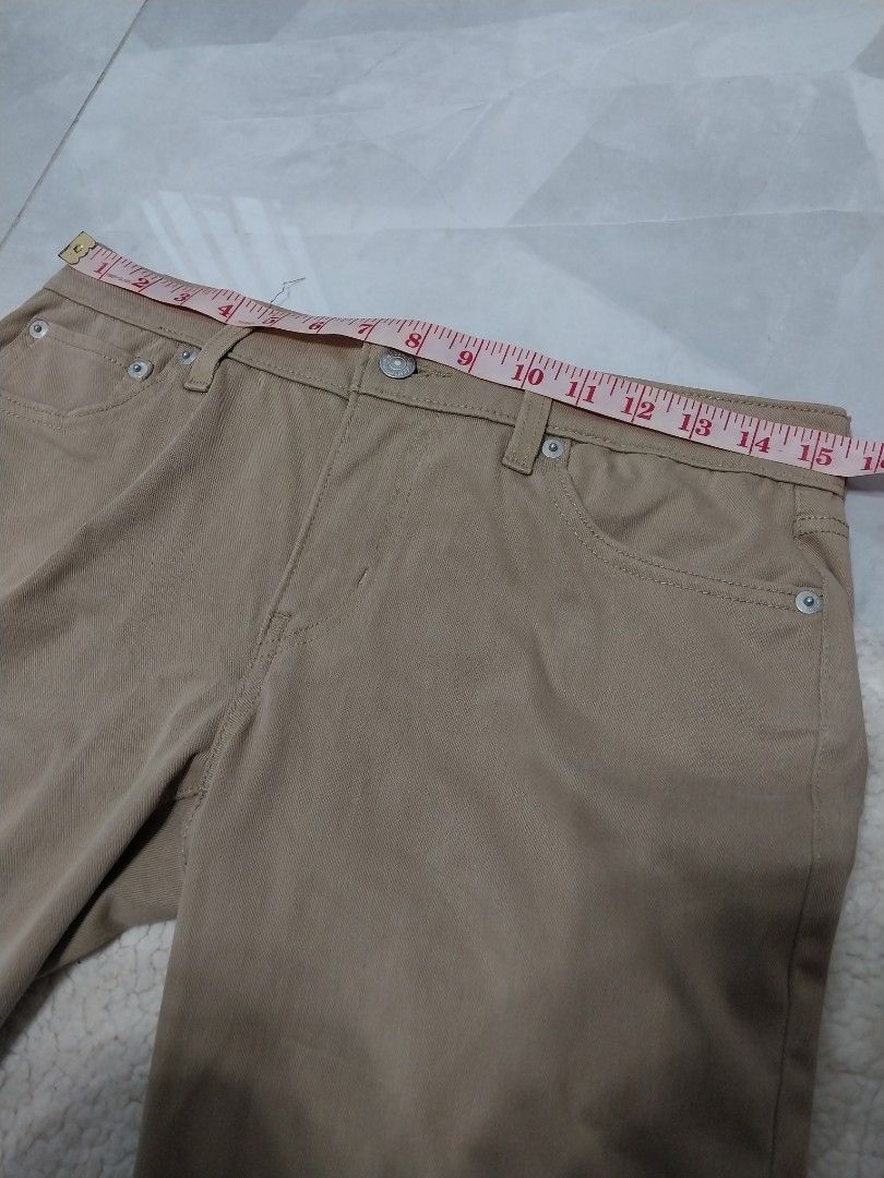 Levi's 501 Beige Pants (Category: Jeans) located in Malaybalay. Submitted by markdaumar08466 (Listing ID 1423335214, Image 2). Description: - Levi's 501 Beige Pants - Waist: Approximately 15 inches - Inseam: Approximately 29 inches - Classic five-pocket design - Features Levi's red tab - Button fly - Straight leg cut - Leather patch on back.