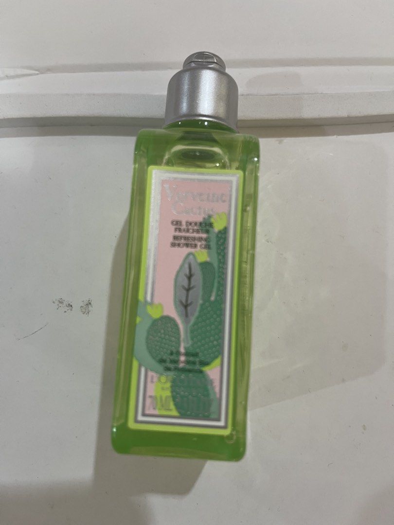 L'Occitane Verbena Cactus Shower Gel 70ml (Category: Bath) located in Manila. Submitted by marylouche42170 (Listing ID 1423308752, Image 1). Description: - L'Occitane Verbena Cactus Shower Gel - 70ml bottle - Refreshing scent - Made in France - Features a cactus design - Contains green liquid.