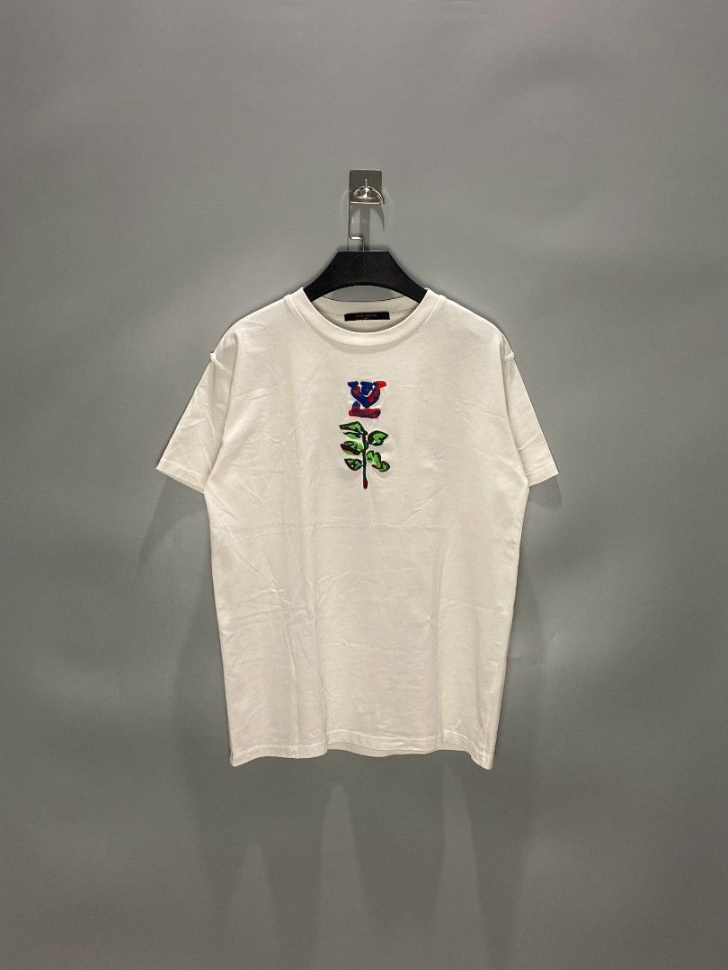 Louis Vuitton Embroidered White T-shirt (Category: Luxury Apparel) located in Mangaldan. Submitted by kendrops (Listing ID 1423300054, Image 1). Description: - Louis Vuitton T-shirt - White color with embroidered design - Classic crew neck and short sleeves - Size: M - Features a small Louis Vuitton label - Made in Italy.