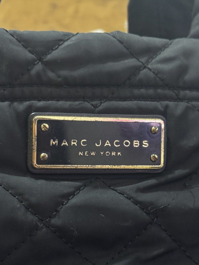 Marc Jacobs Quilted Nylon Mini tote (Category: Luxury Bags & Wallets) located in Manila. Submitted by happylittlekitten (Listing ID 1423377252, Image 3). Description: Marc Jacobs Quilted Nylon Mini tote bag Used but not abused Needs wash lang RFS: decluttering Shipping thru lalamove or jnt .