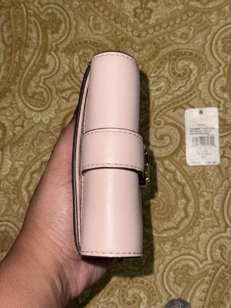 MK Trifold Wallet (Category: Wallets & Card holders) located in Manila. Submitted by healyx (Listing ID 1423407470, Image 3). Description: MK Carmen Medium Flap Trifold Wallet in Pink Blush 6 card slots bill compartment Coin pocket with zip Like new condition, barely used RFS: Decluttering Price negotiable .