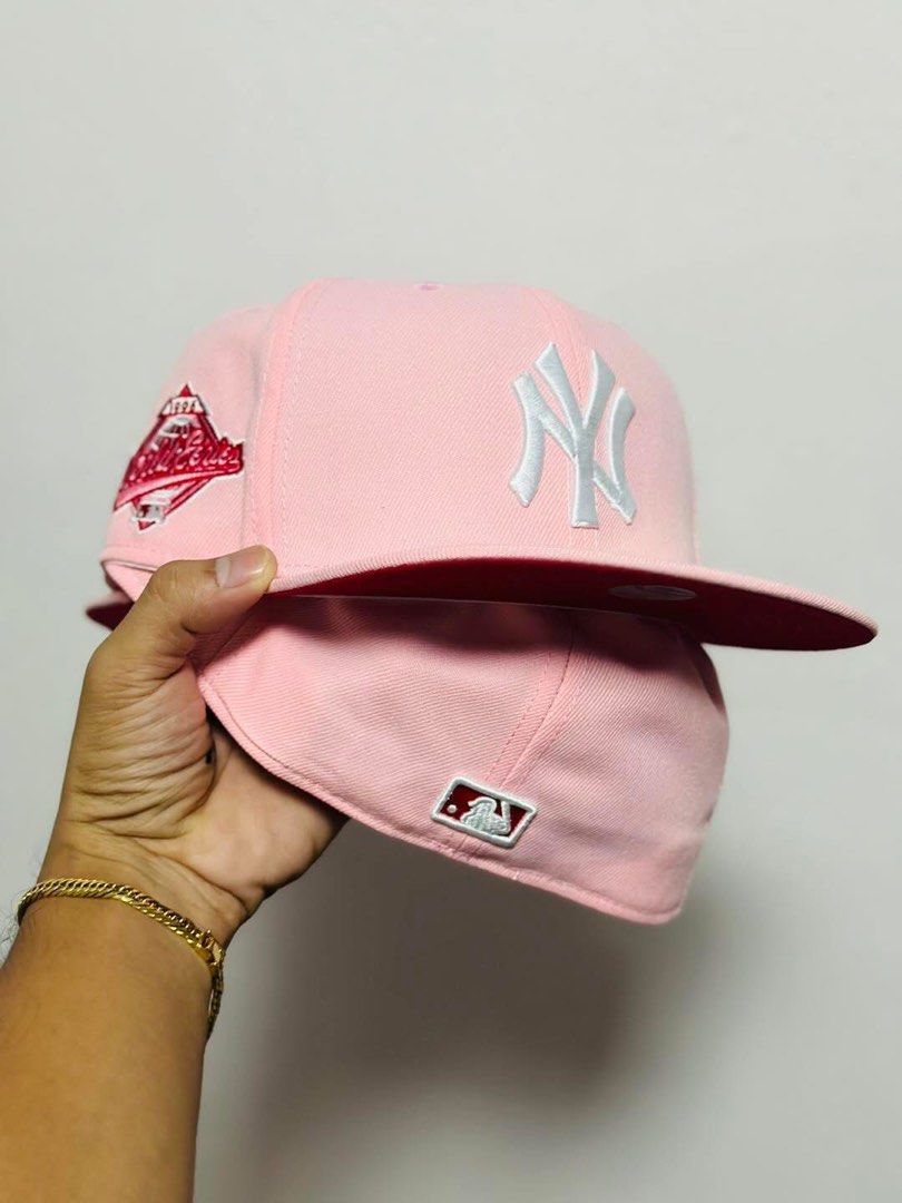 New York Yankees Pink Cap (Category: Caps & Hats) located in Dinalupihan. Submitted by capsnpffs (Listing ID 1423319515, Image 1). Description: - New York Yankees cap - Pink base with white Yankees logo - Features a red brim - Includes a World Series patch - Official MLB logo present - A stylish accessory for any fan.
